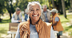 Portrait, volunteer and woman in park, food donations and charity for community outreach. Happy, activist and mature person with NGO project, outdoor and social responsibility for welfare support
