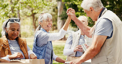 Buy stock photo Volunteer, donations and people in park with high five, motivation and collaboration in relief campaign. Happy, man or woman outdoor with success, teamwork and distribution in charity project.