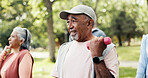 Man, dumbbells and old people in park with workout, class and nature for senior fitness club. Retirement, hobby and weights with mature group, outdoor or exercise together for health and wellness