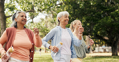 Buy stock photo Fitness, walking and senior women in park with smile, retirement exercise or training for health. Personal trainer, outdoor workout or elderly people with water bottle for wellness, active or cardio