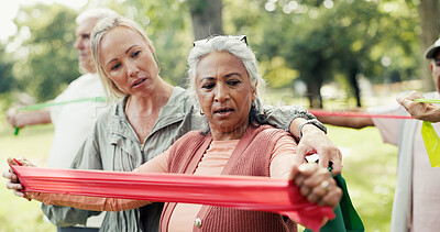 Buy stock photo Resistance band, coach and senior people in nature for exercise class with stretching. Fitness, equipment and group of elderly friends with personal trainer for arm workout with wellness in park.