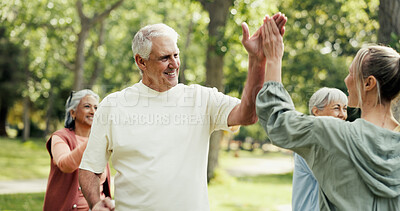 Buy stock photo Personal trainer, high five and old people in park with fitness, class and nature for support or help. Retirement, hobby and instructor with elderly group, celebration or workout for wellness advice