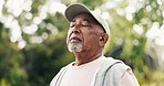 Fitness, breathe or old man in nature with thinking, fresh air or rest after physical activity. Wellness, bokeh or senior person with mindfulness, daydreaming or outdoor break in retirement hobby.
