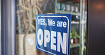 Store, open and notice on front door with sign, information and entry board at small business. Available, operating or message on storefront with cardboard, welcome or announcement display at startup