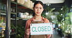 Entrepreneur, closed sign or portrait of woman by nursery door, service communication or info for customer. Garden center, availability message or business owner by entrance, notice board or day end