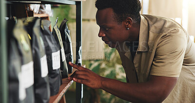 Buy stock photo Soil, plant and inspection with black man in nursery for quality control, botany specialist and entrepreneur. Small business, garden inventory and fertilizer with person for eco friendly store