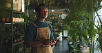 Black man, tablet or thinking in nursery with checklist, inventory management or supplier order. Botanist, sustainable business or tech in store for plant storage, website planning or quality control
