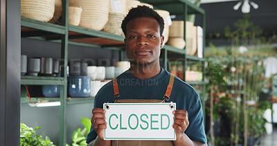 Buy stock photo Closed sign, portrait and nursery with black man in store for announcement, eco friendly shop and signage. Pride, small business and entrance with person for storefront, retail and notice board