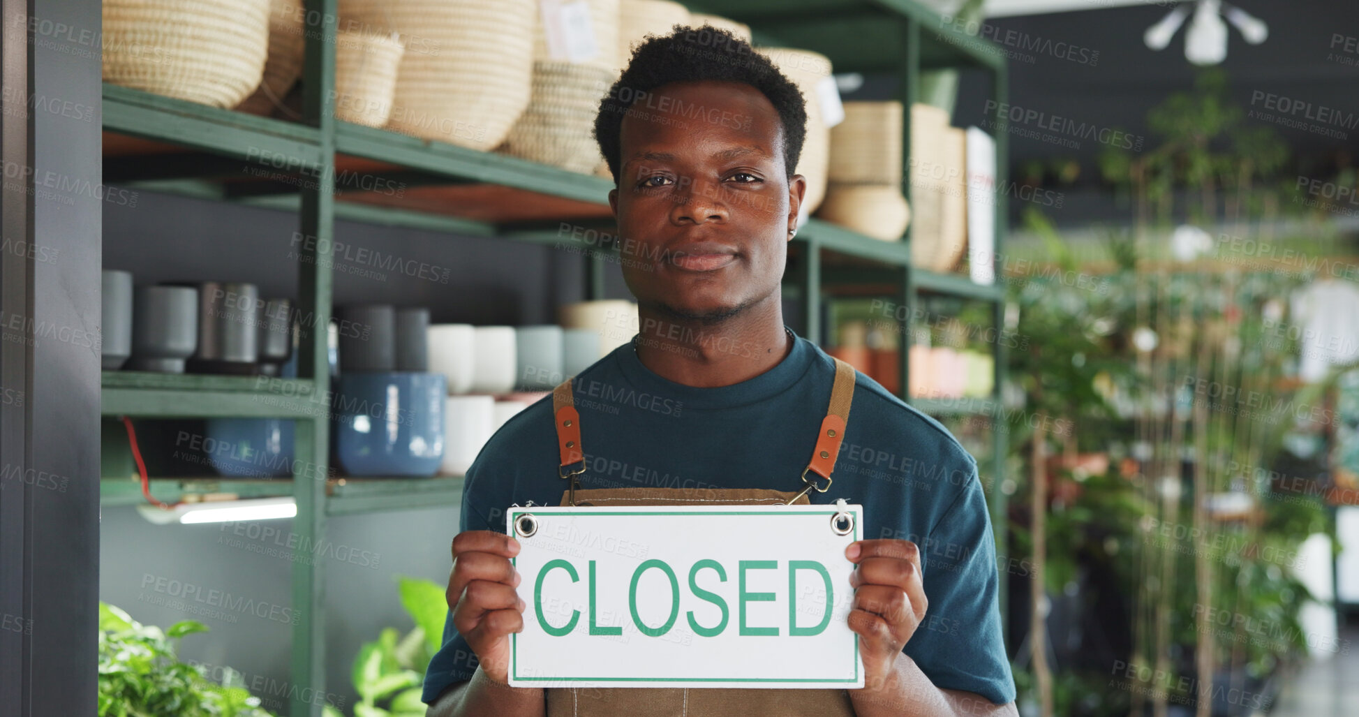 Buy stock photo Closed sign, portrait and nursery with black man in store for announcement, eco friendly shop and signage. Pride, small business and entrance with person for storefront, retail and notice board