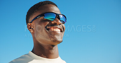 Buy stock photo Smile, sunglasses and travel with black man outdoor for summer vacation, relax and fashion. Happiness, holiday trip and uv protection gear with person in nature for mockup space, tourism and blue sky