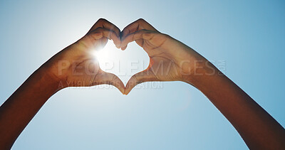 Buy stock photo Person, outdoor and heart hands in sunshine for travel, blue sky and summer vacation. Tourist, love emoji and lens flare in nature space for holiday, environmental care and low angle in paradise