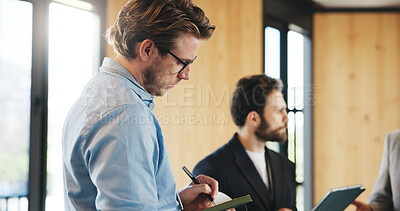 Buy stock photo Business, meeting or man at seminar with notes, staff or mentor training in project growth. Writing, group of employees in agency with tech, learning session or skills development in company workshop