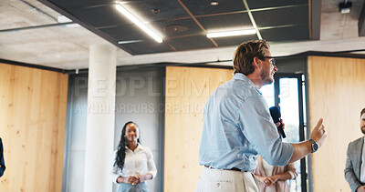 Buy stock photo Business, workshop or man in circle with mic, training or expo in skills development. Smile, group of people at corporate seminar with speech, engagement or motivation for professional growth