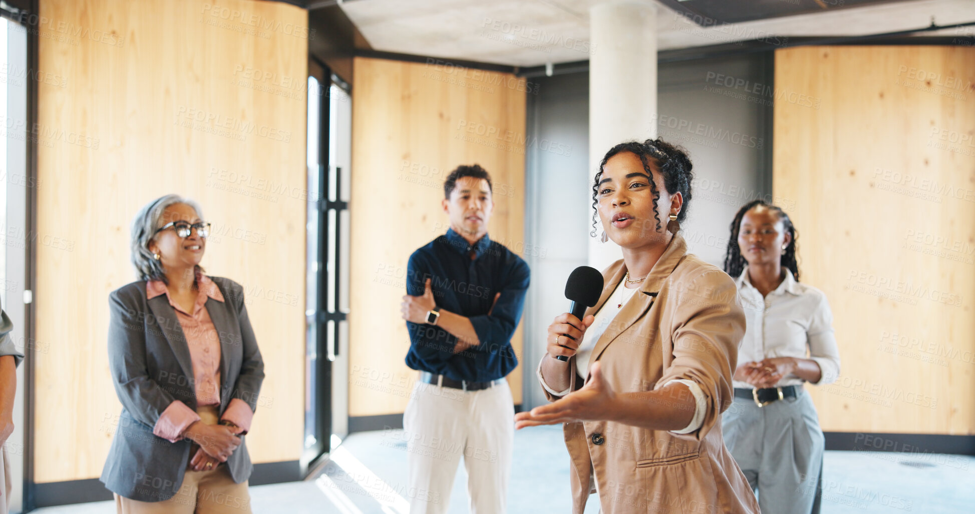 Buy stock photo Motivation, workshop or presenter in circle with mic, training or expo in skills development. Business, group of employees at seminar with speech, engagement or empowerment for professional growth