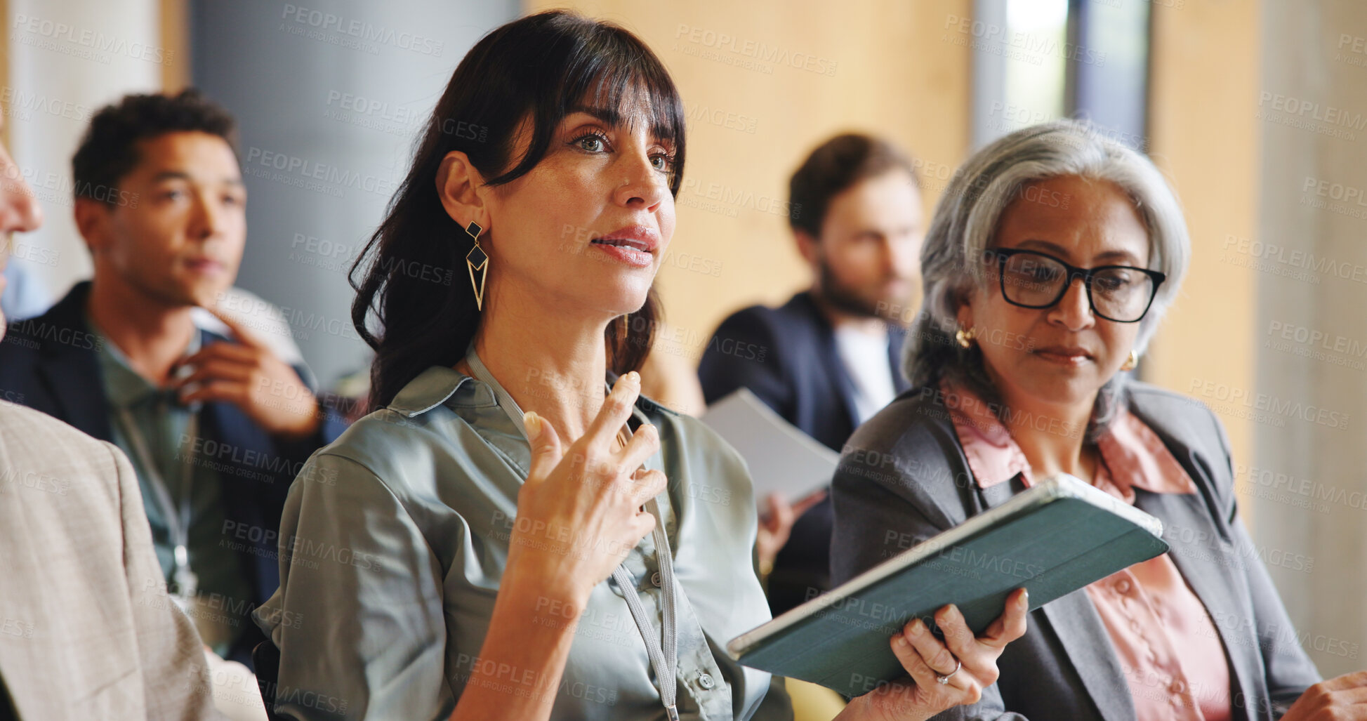 Buy stock photo Business woman, tablet and talk at conference with group for corporate training, explain or respond at seminar. Executive, tech and feedback with insight for professional development at convention