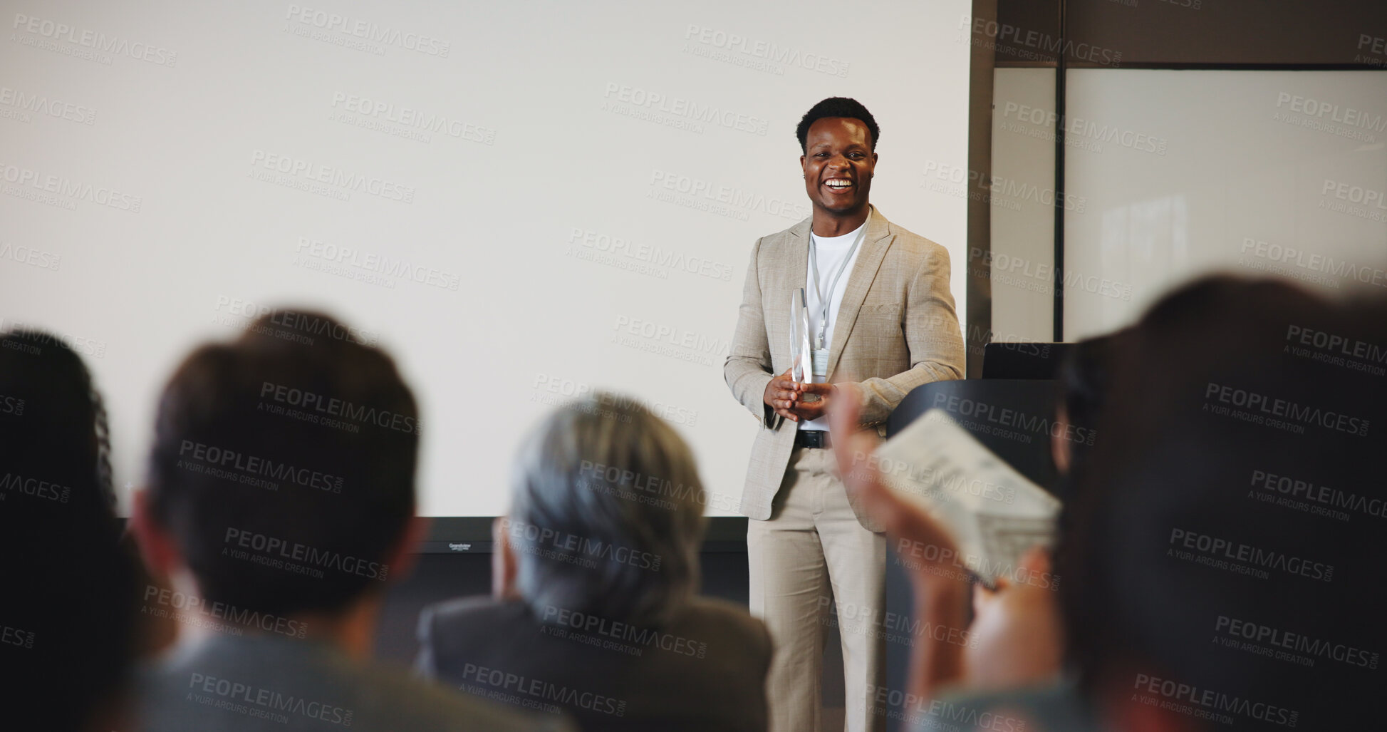 Buy stock photo Man, audience and speaker with award for presentation, business conference or event. Workshop, congratulations and prize announcement with coach, achievement or recognition for career development
