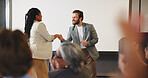 Handshake, audience and speaker with award for presentation, business conference or event. Workshop, shaking hands and prize announcement with coach, achievement and trophy for career development
