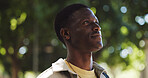 Black man, thinking or outdoor with smile for travel, peaceful trip or fresh air at bokeh. Male person, tourist or reflection in nature for relax, mental health wellness or new perspective in Nigeria