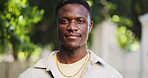 Black man, portrait and outdoor on campus with smile, space and positive for learning, scholarship or academics. Male person, student and college pride with growth or development for higher education