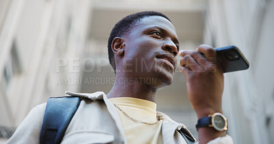 Buy stock photo Black man, student and phone call in city with speaker, contact and speech to text software. Person, technology and voice note at university for networking, low angle or study reminder in application