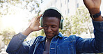 Man, student and dancing in city with headphones, favorite song or rhythm on morning commute. Black person, college academic or streaming music in town with energy, travel or positive for scholarship