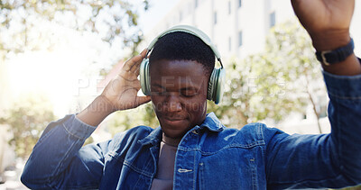 Buy stock photo Man, student and dancing in city with headphones, favorite song or rhythm on morning commute. Black person, college academic or streaming music in town with energy, travel or positive for scholarship