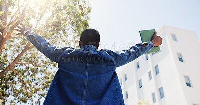 Buy stock photo Man, student and tablet in city with freedom, academic achievement or scholarship opportunity. Back, low angle or person outdoor with tech for university acceptance, success or funding grant to study