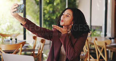 Buy stock photo Woman, selfie and blow kiss in restaurant for social media, blog update and content creation. Customer, gesture and photography in cafe for networking, share post online and follower engagement