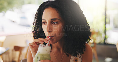 Buy stock photo Woman, drink matcha and thinking in coffee shop and iced beverage for thirst, refreshing or hydration with straw. Green smoothie, milkshake and person with cold liquid in glass for reflection at cafe
