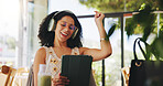 Woman, headphones and tablet in cafe with success, audiobook or university portal with positive exam results. Student, cheering or yes for good test score, drink and audio tech in college cafeteria