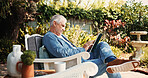 Senior man, relax and tablet in backyard for social media, browsing website and morning news. Elderly person, resting and digital for reading ebook, download games and outdoor for app subscription