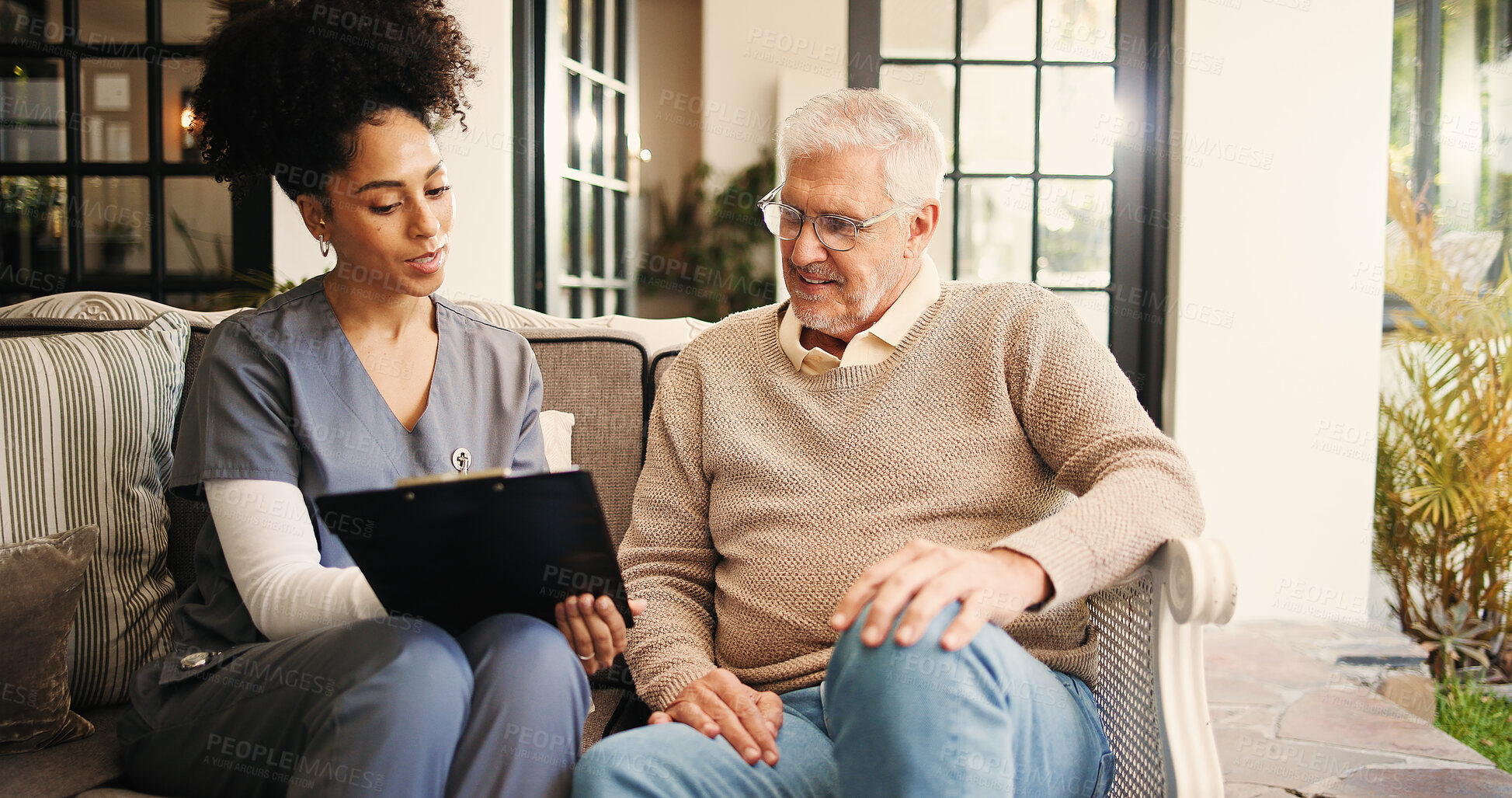 Buy stock photo Clipboard, discussion and nurse with senior man on sofa for consultation at retirement home. Healthcare checklist, checkup and caregiver with elderly male patient in living room for medical diagnosis