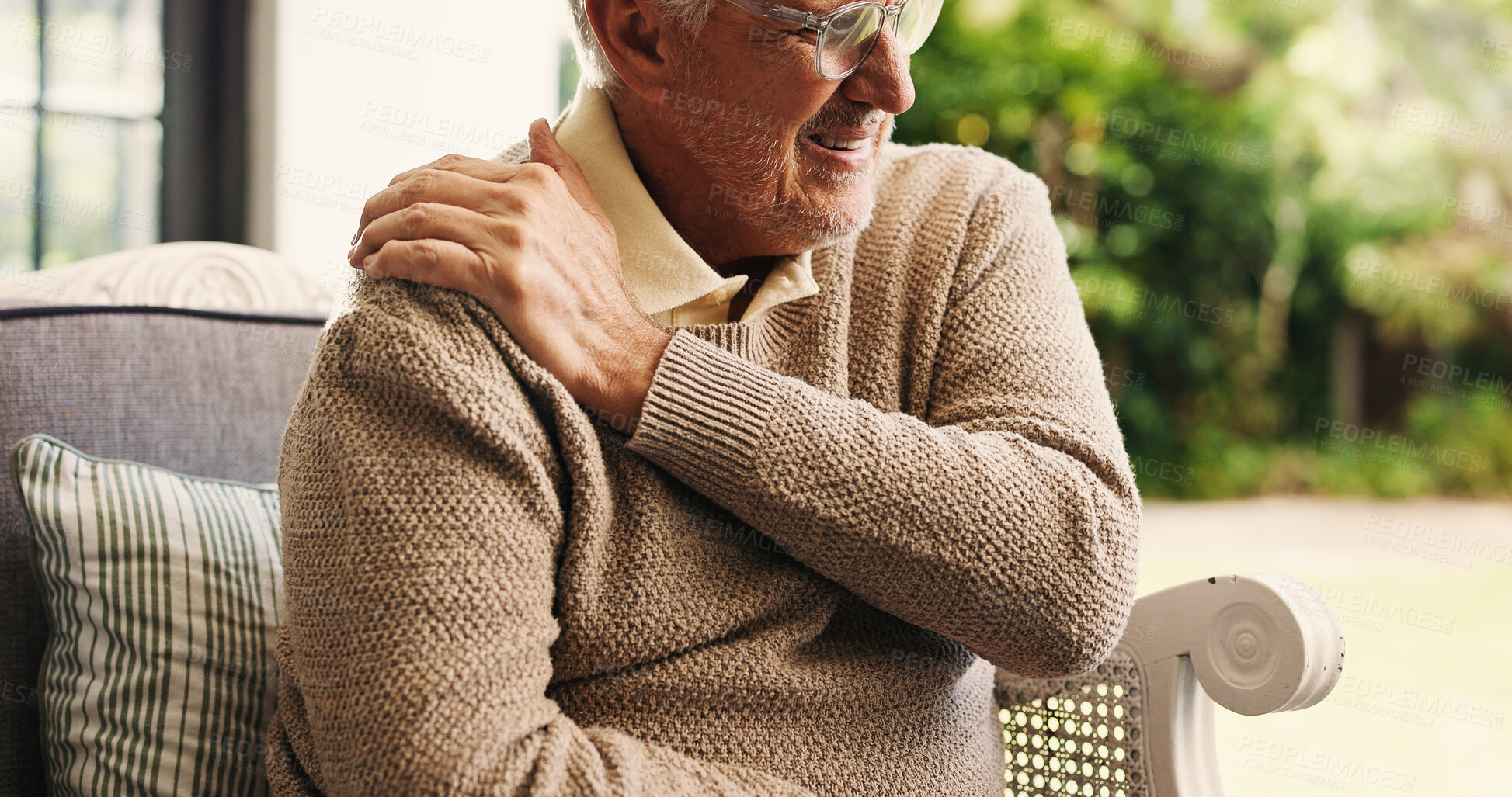 Buy stock photo Hands, sofa and shoulder pain in home, injury and senior man in lounge with joint inflammation. Elderly person, frustrated and muscle fatigue for osteoporosis, tendinitis and stress on couch at house