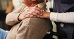 Senior man, wheelchair and holding hands with nurse for assisted living in retirement home. Caregiver, volunteer or helping elderly male person with a disability for healthcare or support in house