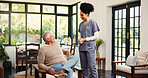 Conversation, caregiver and senior man in nursing home, retirement assistance and kindness for wellness. Smile, discussion and nurse with old person for support, elderly care and empathy for health