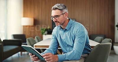 Buy stock photo Reading, tablet and business man in office for finance review, investment and trading analyst. Professional, financial advisor and mature person on digital tech for stock market, research and profit