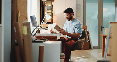 Buy stock photo Ecommerce, man and writing in office with box for customer order, shipping inspection or verification. Person, reading package or notes in workplace for logistics, quality control or courier service.