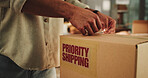 Label, logistics and hands of man with box in office for distribution with priority shipping for delivery. Sticker, cardboard package and person with ecommerce parcel for express service with cargo.