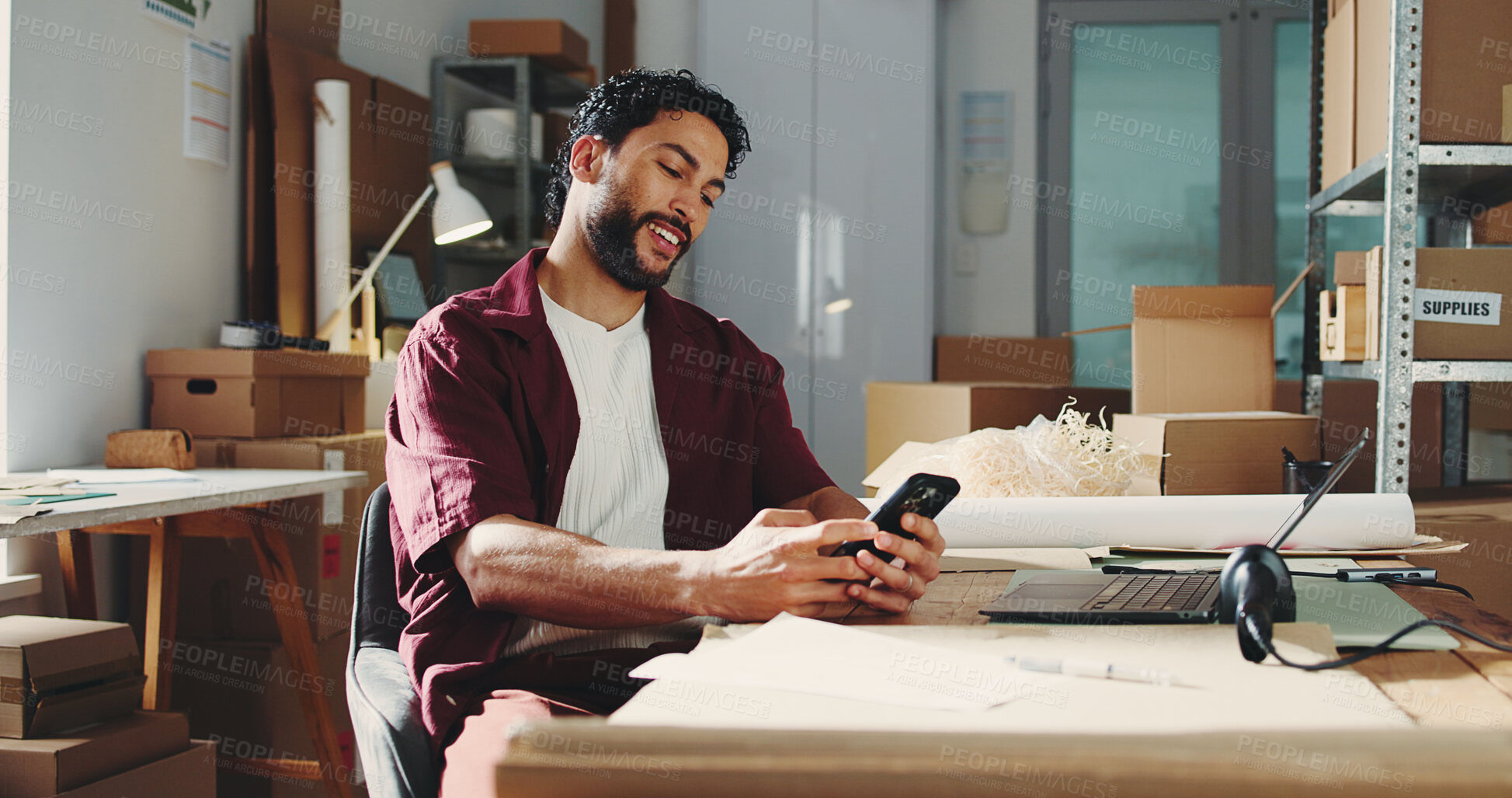 Buy stock photo Logistics, startup and man with smartphone, happy or new order on web, scroll and stock distribution. Review, sales and person with mobile for shipping updates, browsing and entrepreneur in warehouse