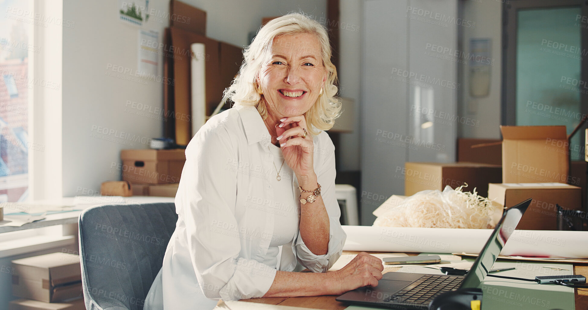 Buy stock photo Ecommerce, portrait or woman in office with laptop, pride or experience in shipping industry. Happy, mature person or dispatch agent in workplace with tech, about us or confidence in logistics sector