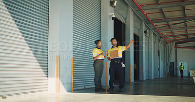 Buy stock photo Supply chain, coworkers and discussion at storage facility with clipboard, dispatch or shipping plan. Logistics people, talking or point at warehouse with checklist, distribution and quality control.