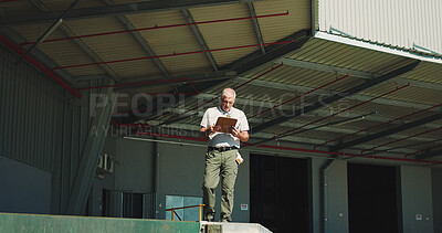 Buy stock photo Logistics, clipboard and reading with man outdoor for inventory management, delivery planning or export. Shipping route schedule, distribution supervisor or inspection with mature person at warehouse