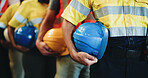 People, line and hands with helmet in warehouse for freight safety regulations or shipping cargo. Group, supplier team or distributor in row with hard hat for maintenance or supply chain service