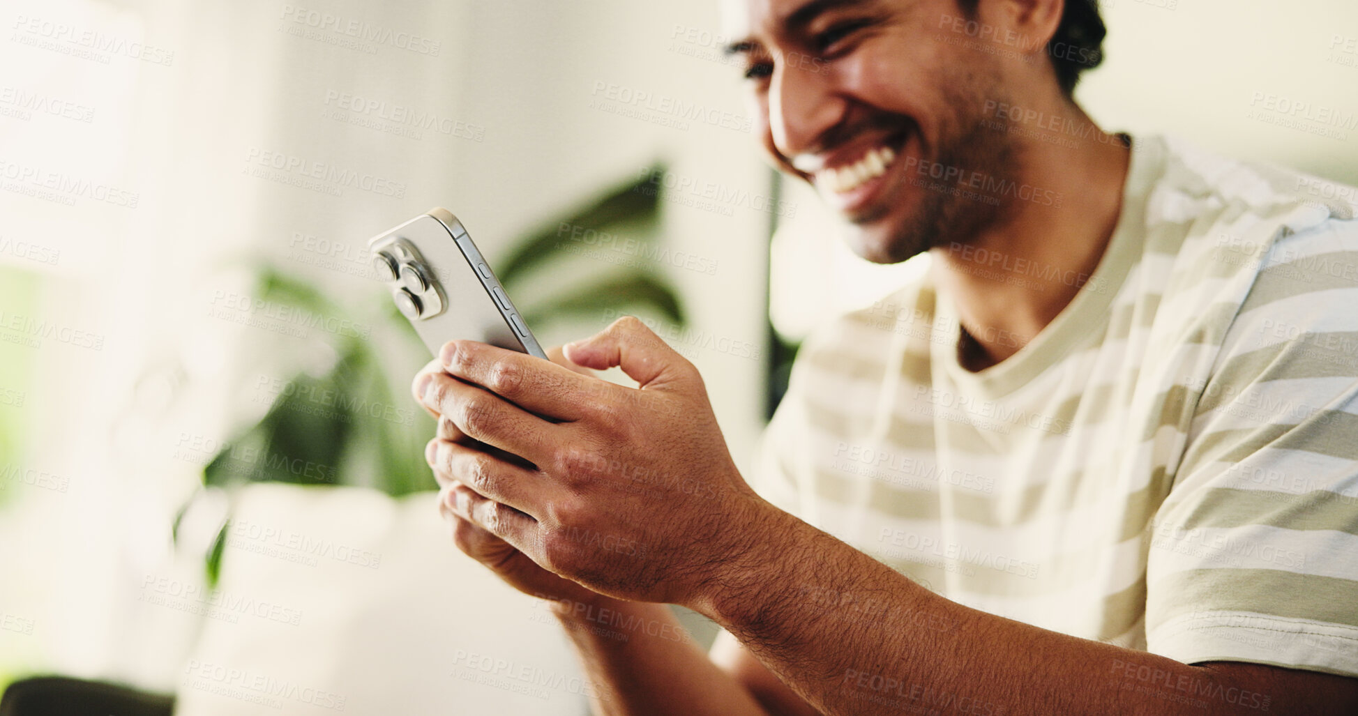 Buy stock photo Phone, relax and man on sofa in home for texting, social media or chatting on mobile app. Happy, technology and male person with cellphone for communication, connection or networking in living room.