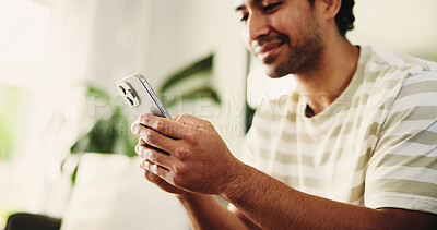 Buy stock photo Home, smartphone and man on sofa, typing and social media with communication. Email notification, mobile user and person with cellphone, internet and network with connection, online reading and app