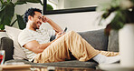 House, smartphone and man on couch, funny and typing with social media, smile and online reading. Laughing, mobile user and Asian person on sofa, cellphone and website info with connection or humor