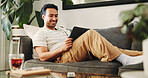 Man, tablet and happy on sofa, relax and streaming service for movies in living room at home. Person, tech and smile with application, video and film subscription on web, couch or scroll at apartment