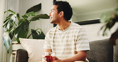 Buy stock photo Man, thinking and tea cup on sofa in home with reflection, memory and smile for nostalgia in living room. Person, perspective and relax on couch for drink, beverage or daydream in lounge at apartment