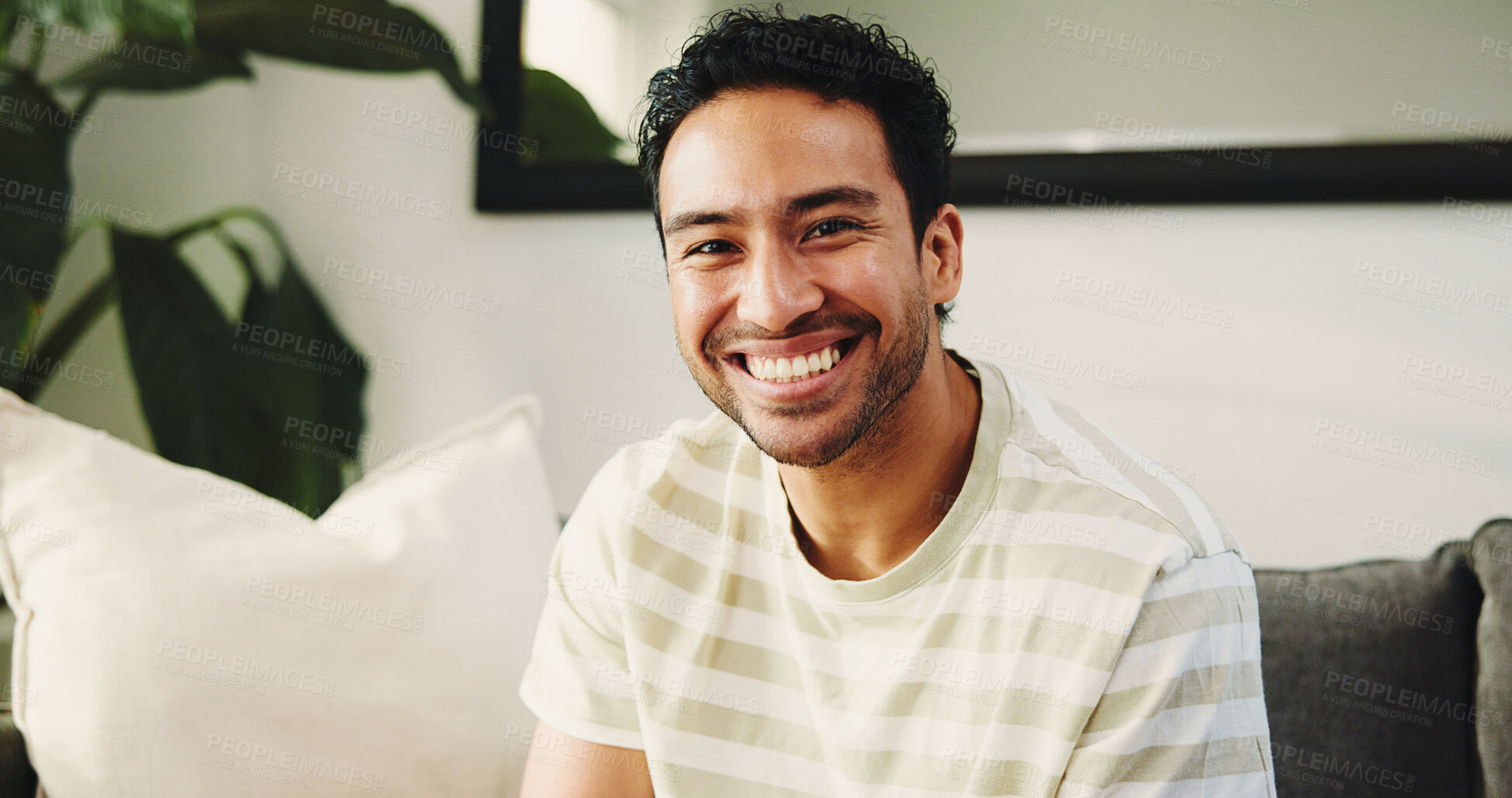 Buy stock photo House, portrait and man on couch, funny and happiness with weekend break in living room. Smile, laughing and Asian person on sofa, comfortable and afternoon with rest, relax and humor with confidence
