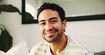 Portrait, happy and man on break, lounge and chilling in apartment or comfortable with stress relief. Confident, person and relax on couch in home, smile and peaceful on weekend and resting in Mexico